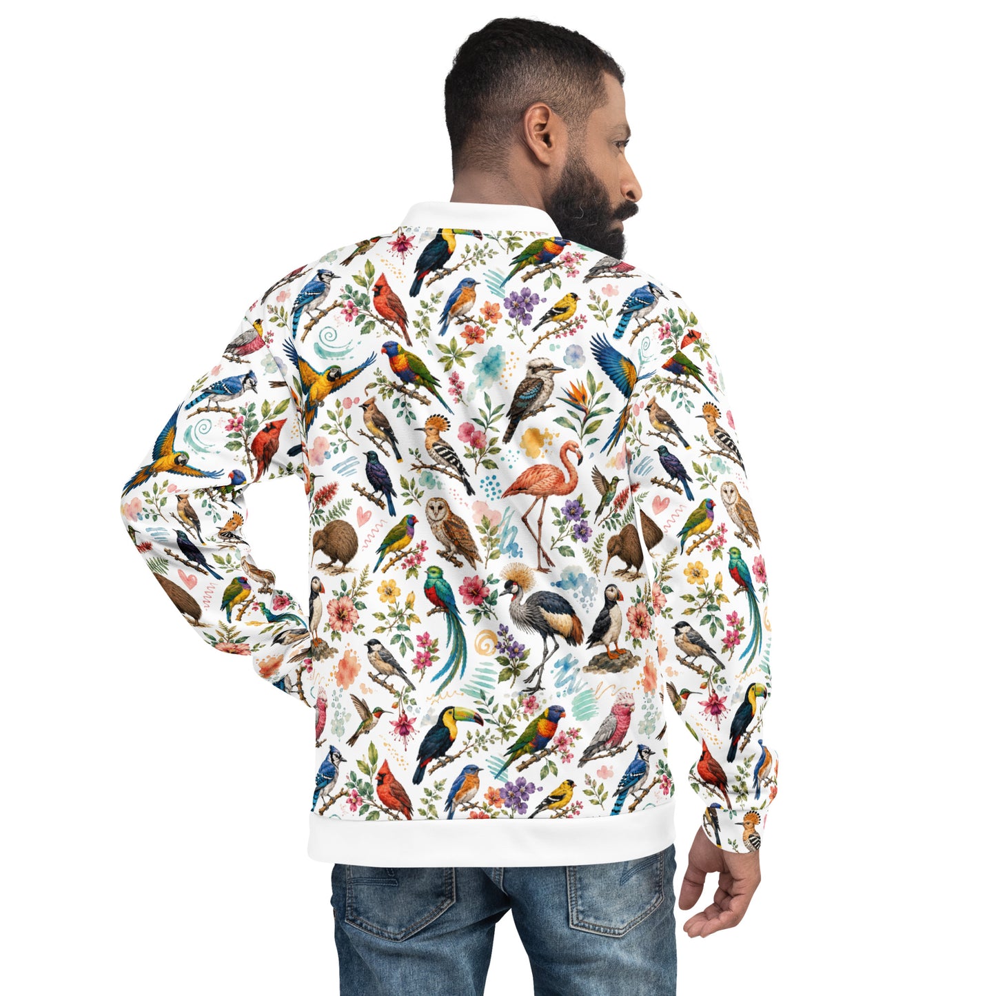 A man shown from the back wearing a white long-sleeve bomber-style jacket covered in a dense, colorful bird and floral print, paired with blue jeans against a plain white background.