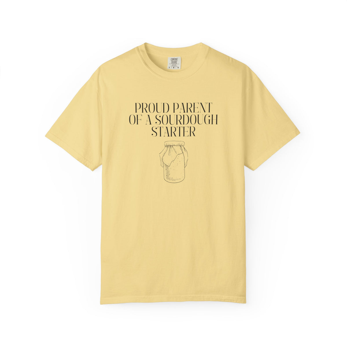 Light yellow colored Comfort Colors® "Proud Parent of a Sourdough Starter" graphic t-shirt on a white background with vintage sourdough starter jar illustration. Funny gift for sourdough bakers and bread enthusiasts.