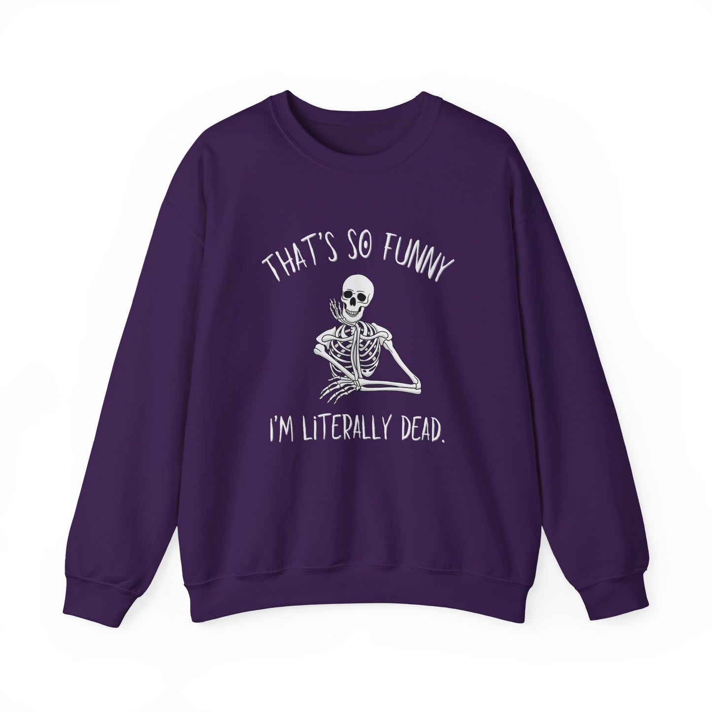 A purple crewneck sweatshirt featuring a white graphic of a skeleton sitting cross-legged with the text 'THAT'S SO FUNNY' above and 'I'M LITERALLY DEAD.' below, displayed on a clean white background.