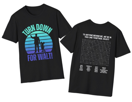 A black short-sleeve graphic T-shirt shown from both front and back on a plain white background. The front features a large circular sunset-style graphic with the words “TURN DOWN FOR WALT!” in teal and purple and the back features a Disneyland themed word search puzzle