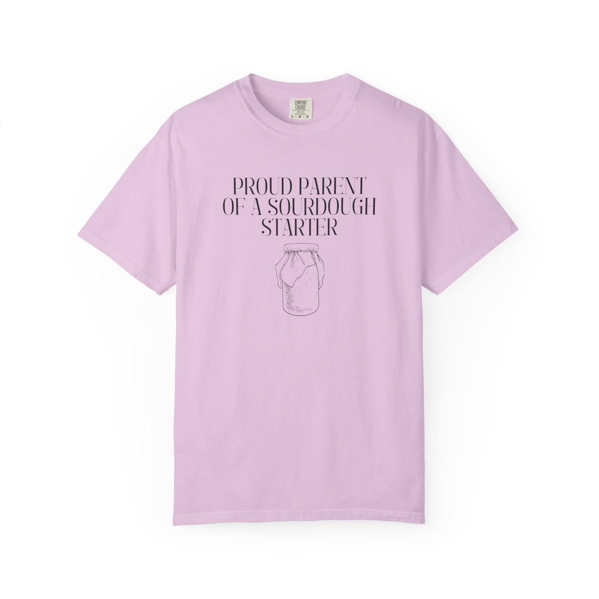 Light pink Comfort Colors® "Proud Parent of a Sourdough Starter" graphic t-shirt on a white background with vintage sourdough starter jar illustration. Funny gift for sourdough bakers and bread enthusiasts.