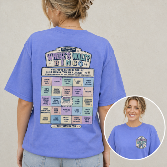 A woman wearing heather royal blue t-shirt, showing the back of the shirt with a large 'Where's Walt? Bingo' interactive game graphic. An inset circle in the bottom right shows the front of the shirt with a matching chest graphic.