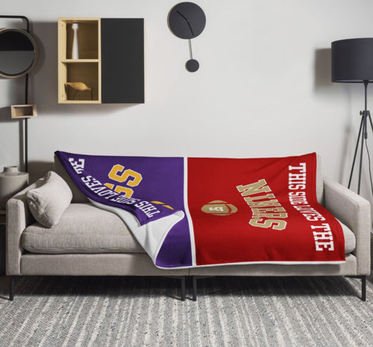 House divided football blanket draped over a couch, one side purple for the Vikings, the other red for the San Francisco 49ers, fully personalized.