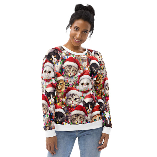 Woman wearing the white all-over-print Christmas cat crewneck sweatshirt with blue jeans, Santa-hat cats and holiday-light print styled as an ugly Christmas sweater.