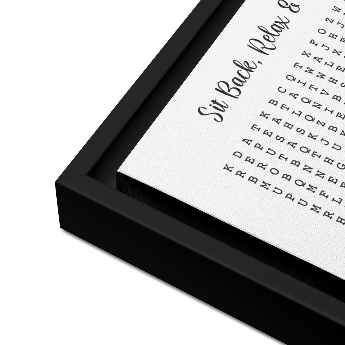 Close-up of a black framed canvas picture on a white background
