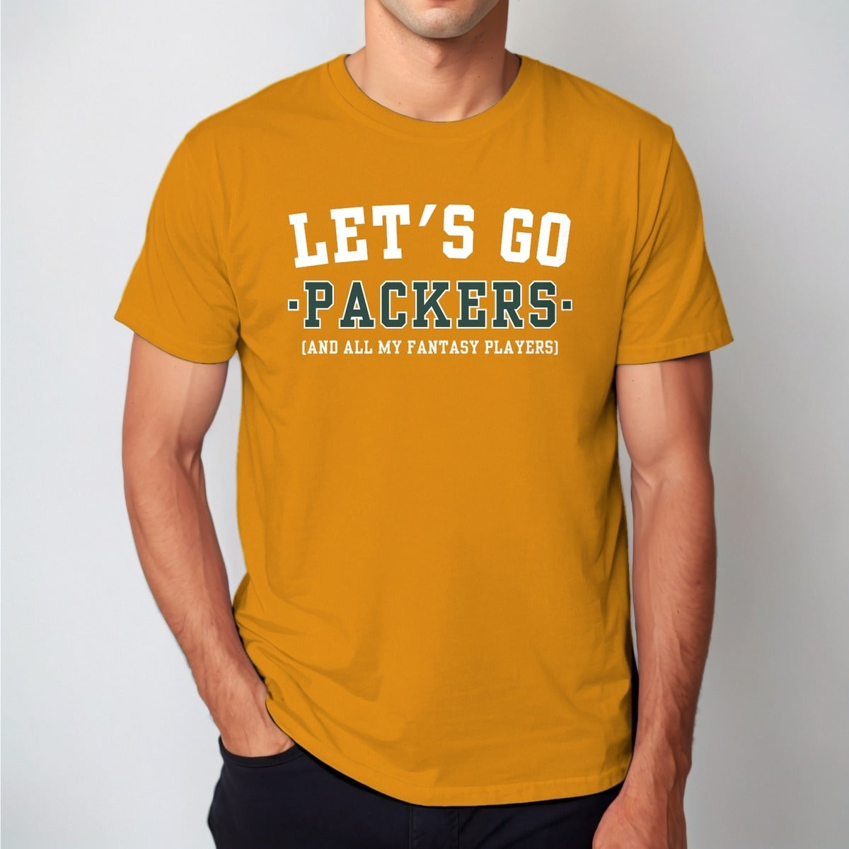 Man wearing the gold Let's Go Packers fantasy football t-shirt with collegiate block lettering