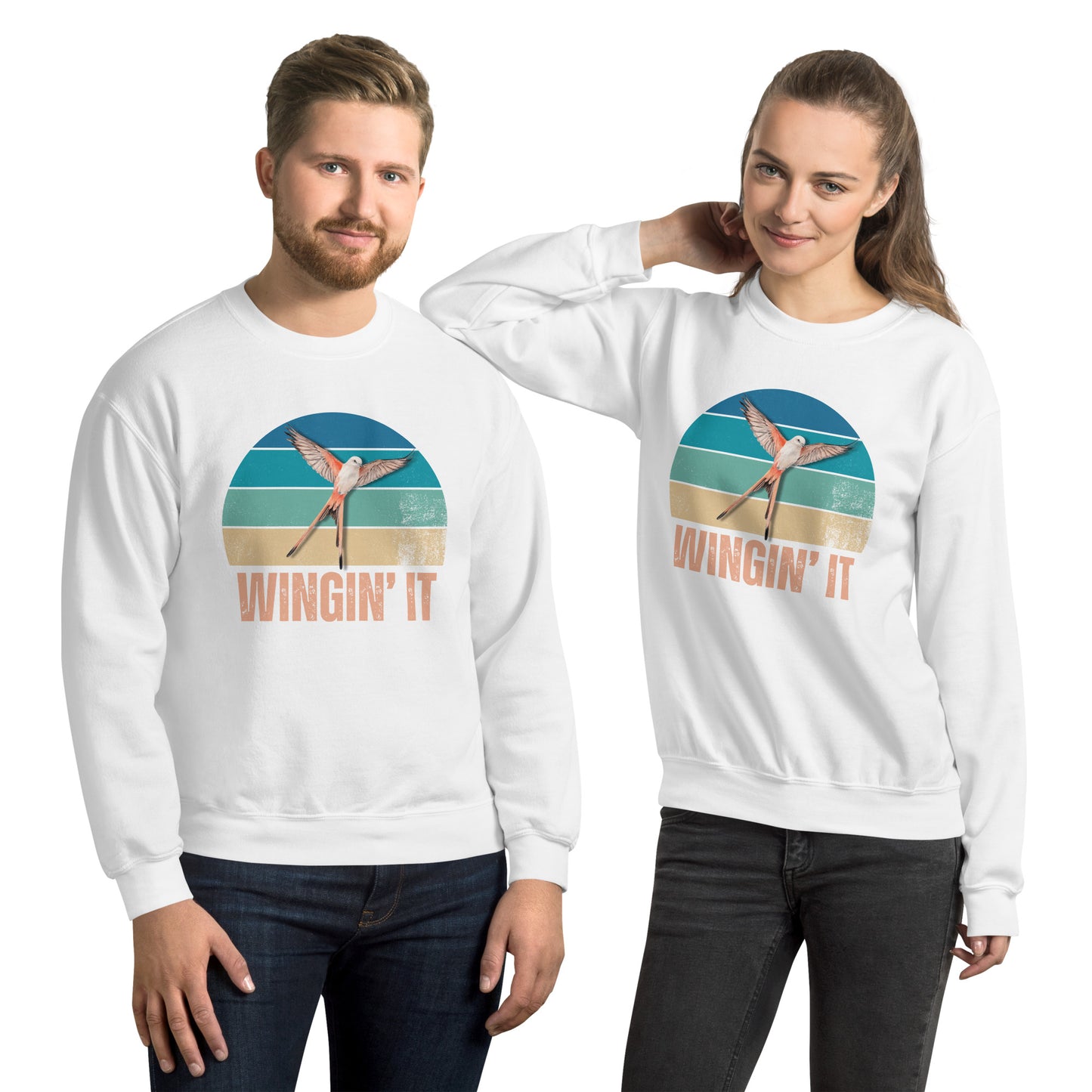 Man and Woman in white Wingin' It crewneck sweatshirts with a Wingspan-inspired scissor-tailed flycatcher and retro sunset design