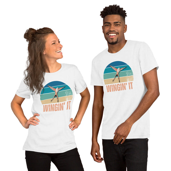 Two smiling models wearing the white Wingin' It bird t-shirt, a funny gift for bird lovers and board game night