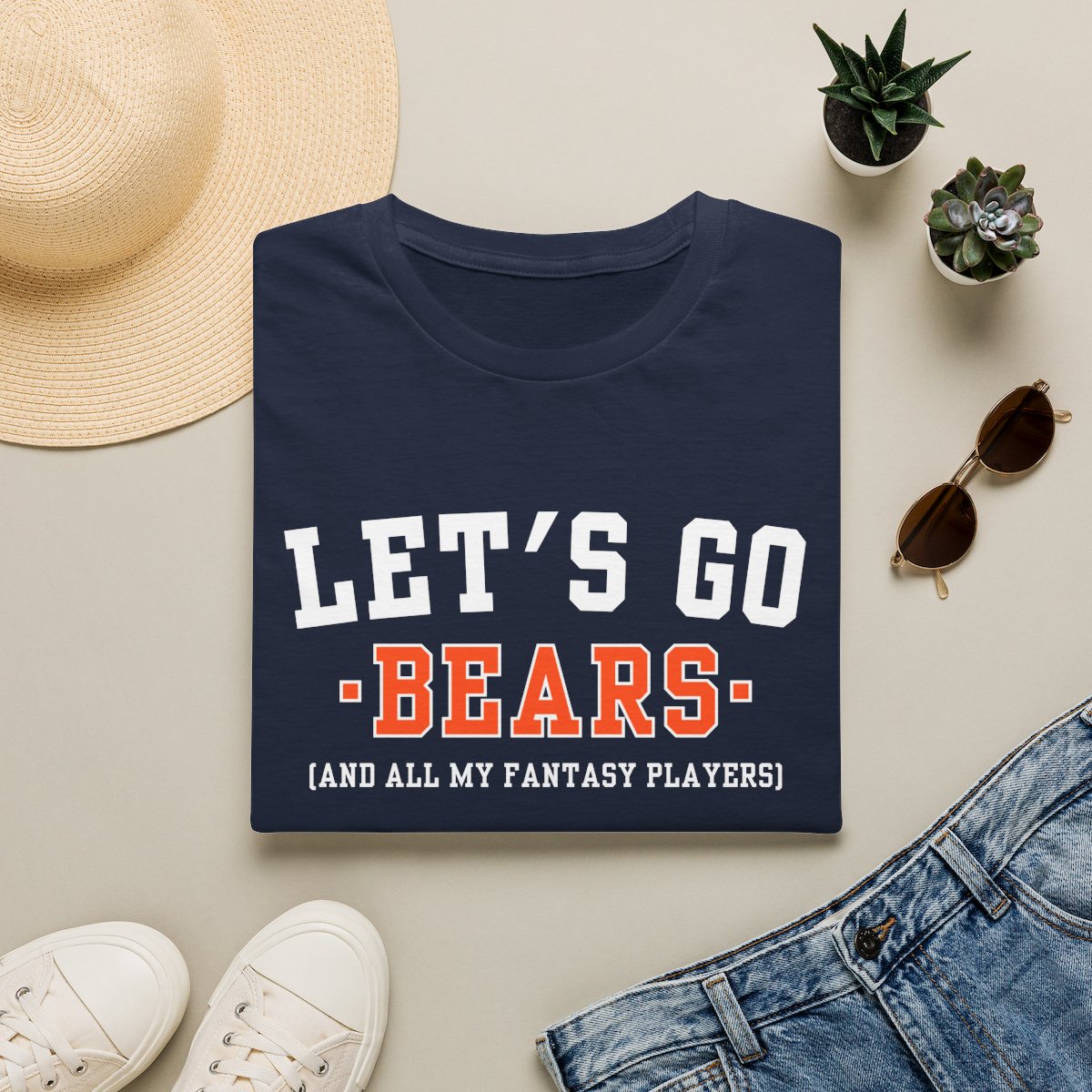 Navy Bears fantasy football tee folded on a neutral flat lay with a straw hat and sneakers